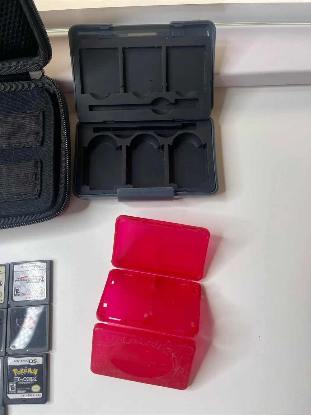 19 Nintendo DS games and Nintendo DS XL case with travel game cases and stylus